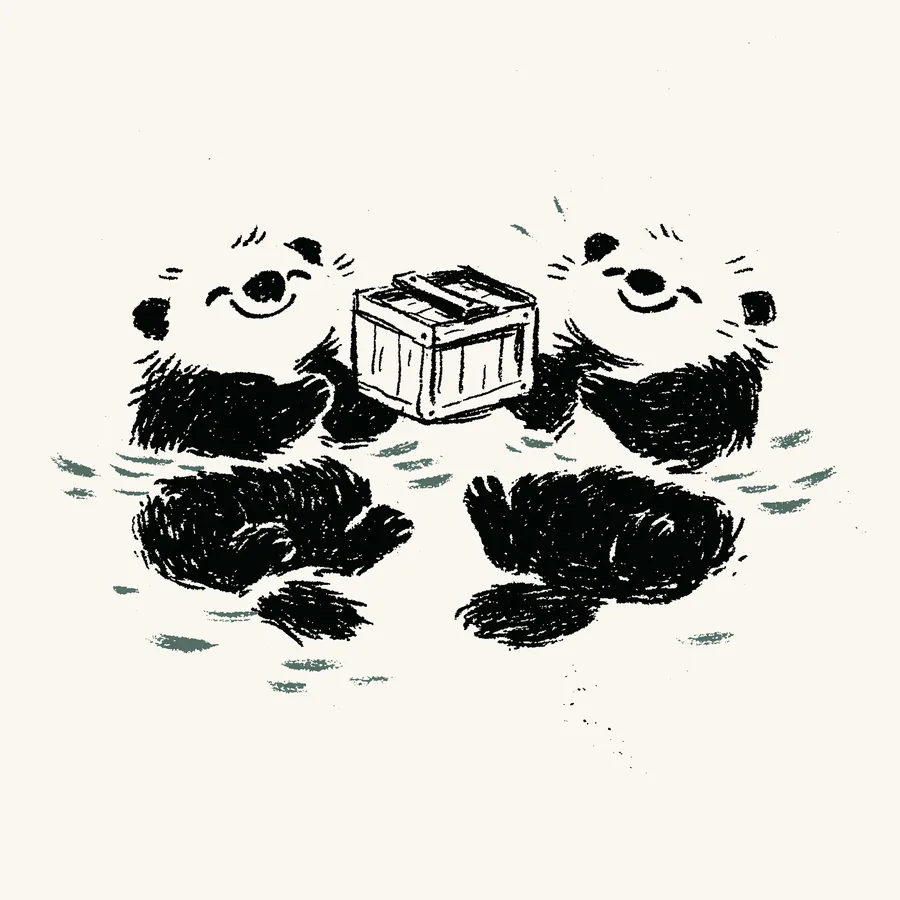 Two otters passing a wooden crate between them